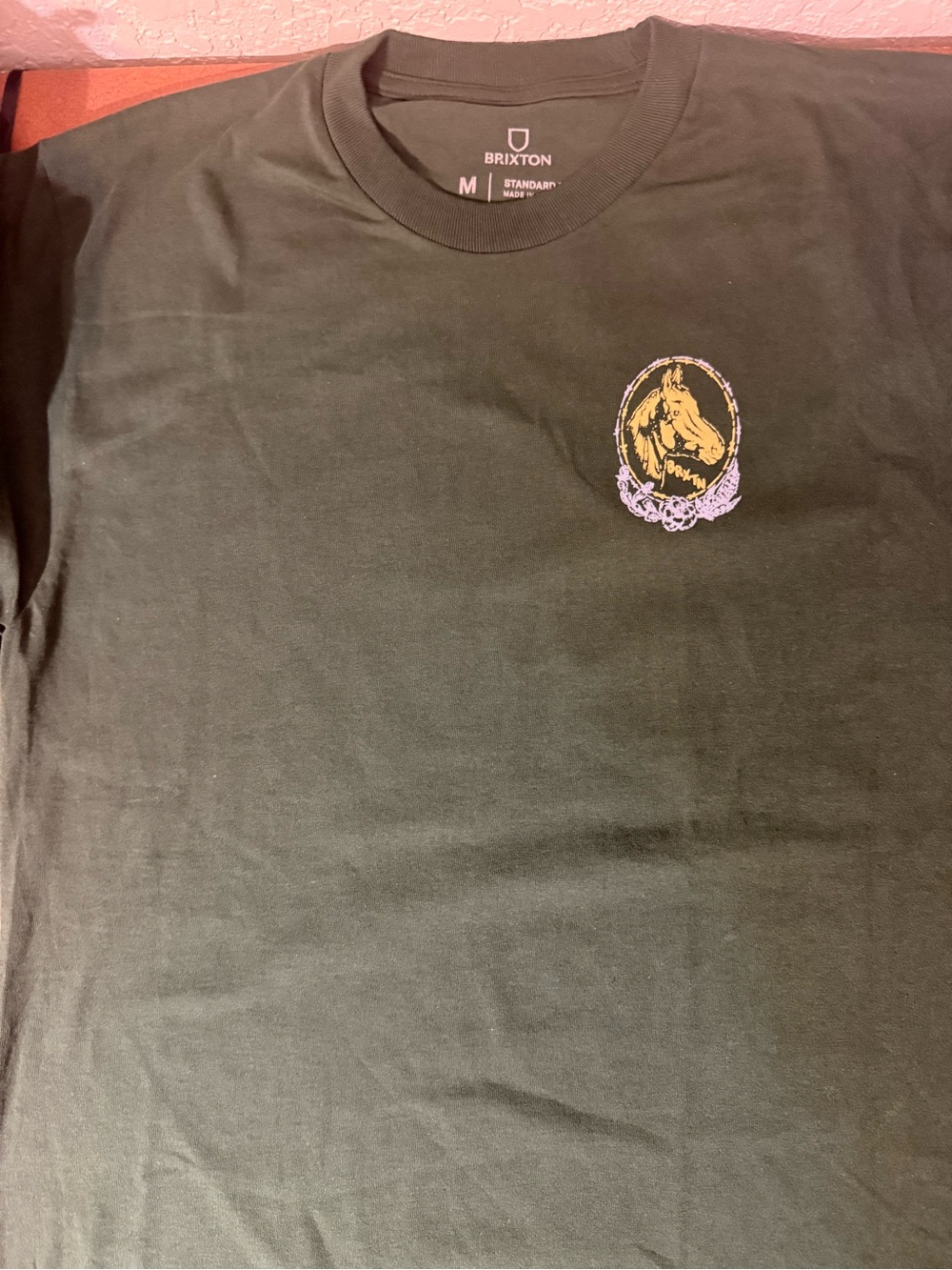 Brixton Dark Green Crewneck Tee with Gold & Purple Horse Emblem